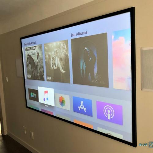  Custom built projector screen and in-wall speakers. 